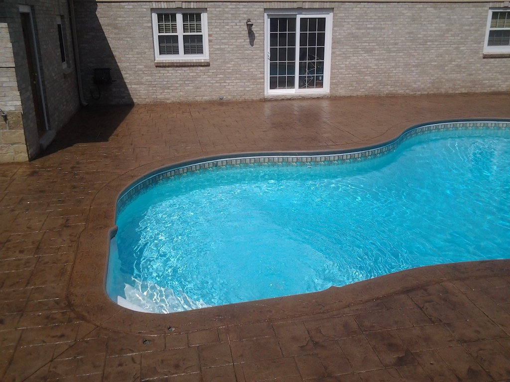 Swimming pool and stamped concrete project example 157